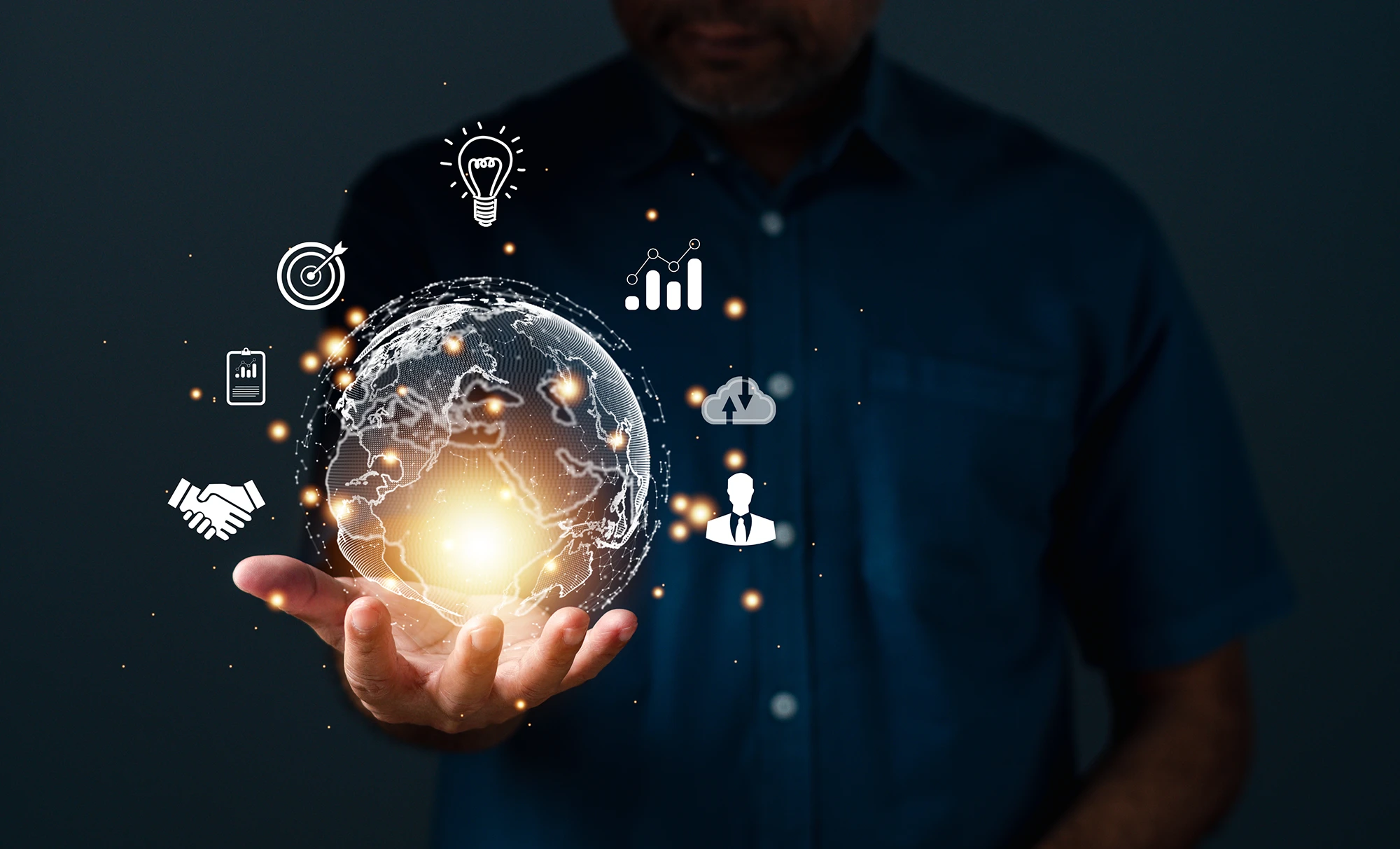 Man holding globe with communication icons surrounding it