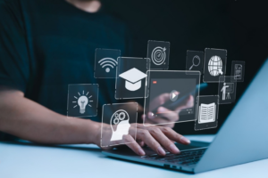 A person using laptop with icons representing online education and eLearning